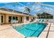 Large screened pool with patio and lounge chairs at 16093 Hillsborough Blvd, Port Charlotte, FL 33954