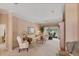 Bright living room featuring a comfortable seating area and large windows at 1136 Highland Greens Dr, Venice, FL 34285