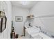 Laundry room with washer, dryer, and shelving at 1136 Highland Greens Dr, Venice, FL 34285