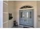 Elegant light blue double front doors with glass accents at 1136 Highland Greens Dr, Venice, FL 34285
