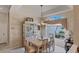 Elegant dining room featuring a chandelier and built-in hutch at 1136 Highland Greens Dr, Venice, FL 34285