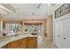 Kitchen with island and access to the backyard pool area at 1136 Highland Greens Dr, Venice, FL 34285