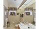Clean bathroom with a shower/tub combo and updated vanity at 1136 Highland Greens Dr, Venice, FL 34285