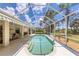 Relaxing screened pool with a beautiful backyard view at 1136 Highland Greens Dr, Venice, FL 34285
