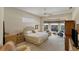 Spacious Primary bedroom with a king-size bed and pool view at 1136 Highland Greens Dr, Venice, FL 34285