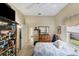 Cozy bedroom with a queen bed and built-in shelving at 1136 Highland Greens Dr, Venice, FL 34285