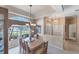 Bright dining room with large windows and a chandelier at 1136 Highland Greens Dr, Venice, FL 34285