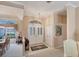 Bright and airy entryway with double doors and coat closet at 1136 Highland Greens Dr, Venice, FL 34285