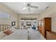 Bright bedroom with a king-size bed and access to the pool at 1136 Highland Greens Dr, Venice, FL 34285