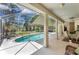 Spacious patio with a view of the refreshing pool at 1136 Highland Greens Dr, Venice, FL 34285