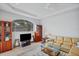 Living Room with a sectional sofa, built in shelving, and large window at 1311 Tuscany Blvd, Venice, FL 34292