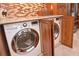 Convenient laundry room with stacked LG washer and dryer at 217 Carriage House Ln # 217, Nokomis, FL 34275