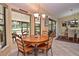Bright kitchen nook with a round table and chairs, and view to backyard at 217 Carriage House Ln # 217, Nokomis, FL 34275