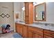 Elegant bathroom with double vanity, granite countertops, and ample storage at 217 Carriage House Ln # 217, Nokomis, FL 34275
