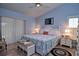 Spacious main bedroom with a king-size bed, and plenty of natural light at 217 Carriage House Ln # 217, Nokomis, FL 34275