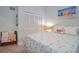 Serene bedroom featuring a seashell-themed bedspread and built-in closet at 217 Carriage House Ln # 217, Nokomis, FL 34275