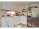 Bright kitchen with white cabinets and stainless steel appliances at 255 Shamrock Blvd, Venice, FL 34293