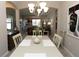 Bright dining room with table, chairs, and view into the living area at 232 Carlino Dr, Nokomis, FL 34275