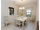 Bright dining room with table, chairs, and hutch at 232 Carlino Dr, Nokomis, FL 34275
