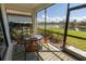 Screened porch overlooking a tranquil lake at 232 Carlino Dr, Nokomis, FL 34275