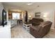 Spacious living room with comfortable seating and large TV at 232 Carlino Dr, Nokomis, FL 34275