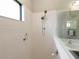 Walk-in shower with grab bar and tiled walls at 232 Carlino Dr, Nokomis, FL 34275
