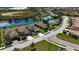 Community overview showing homes, lake, and shared amenities at 232 Carlino Dr, Nokomis, FL 34275