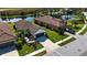 Single-story home with brown tile roof, two-car garage, and manicured lawn at 232 Carlino Dr, Nokomis, FL 34275