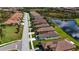 Community overview showing lakefront homes and landscaping at 232 Carlino Dr, Nokomis, FL 34275