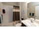 Bathroom with tub shower, single vanity, and toilet at 232 Carlino Dr, Nokomis, FL 34275