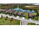 Community overview showcasing homes near a tranquil lake at 232 Carlino Dr, Nokomis, FL 34275