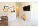 Living space with sofa, TV and additional storage at 232 Carlino Dr, Nokomis, FL 34275
