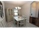 Bright dining room with table, chairs, and hutch at 232 Carlino Dr, Nokomis, FL 34275