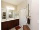 Bathroom with double vanity, large mirror, and separate shower at 232 Carlino Dr, Nokomis, FL 34275