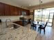 Updated kitchen with granite counters, stainless steel appliances, and access to the backyard patio at 232 Carlino Dr, Nokomis, FL 34275