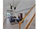 Living room with high ceilings, dark leather furniture, and water views at 23787 Waverly Cir, Venice, FL 34293