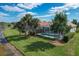 Private pool and spa with screened enclosure and lush landscaping at 23787 Waverly Cir, Venice, FL 34293