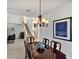 Formal dining room with chandelier and seating for six at 23787 Waverly Cir, Venice, FL 34293