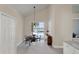 Breakfast nook with lake view and sliding glass doors leading to patio at 23787 Waverly Cir, Venice, FL 34293