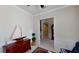Home office with wood furniture and access to a hallway at 23787 Waverly Cir, Venice, FL 34293