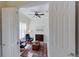 Home office with two leather armchairs, a ceiling fan, and built-in shelving at 23787 Waverly Cir, Venice, FL 34293