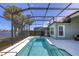 Relaxing screened pool overlooking a lake at 23787 Waverly Cir, Venice, FL 34293