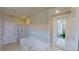 Spa-like bathroom with soaking tub, shower, and private access to a balcony at 23787 Waverly Cir, Venice, FL 34293