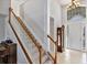 Elegant entryway with staircase, wood flooring, and large window at 23787 Waverly Cir, Venice, FL 34293