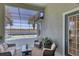 Relaxing screened lanai overlooking pool and lake at 23787 Waverly Cir, Venice, FL 34293