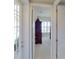 Bright hallway with doors leading to bedrooms and other rooms at 23787 Waverly Cir, Venice, FL 34293