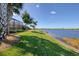 Peaceful backyard oasis with lake access and lush landscaping at 23787 Waverly Cir, Venice, FL 34293
