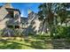 Private backyard with a wooden fence and lush green plants at 201 Woodland Dr # 201, Osprey, FL 34229