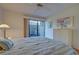 Bright bedroom with patio access and built-in dresser at 201 Woodland Dr # 201, Osprey, FL 34229