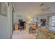 Spacious living area with tiled floors, comfortable seating, and home office space at 201 Woodland Dr # 201, Osprey, FL 34229